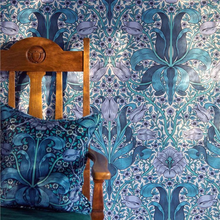 Morris & Co. Spring Thicket Velvet Fabric in Midnight/Lilac featuring flowing botanical foliage and elegant tulip flowers in deep midnight blue, soft lilac, and muted natural tones. Luxurious cotton velvet designer fabric ideal for drapes, window shades, upholstery, headboards, decorative pillows, cushions, and classic English-inspired interiors.