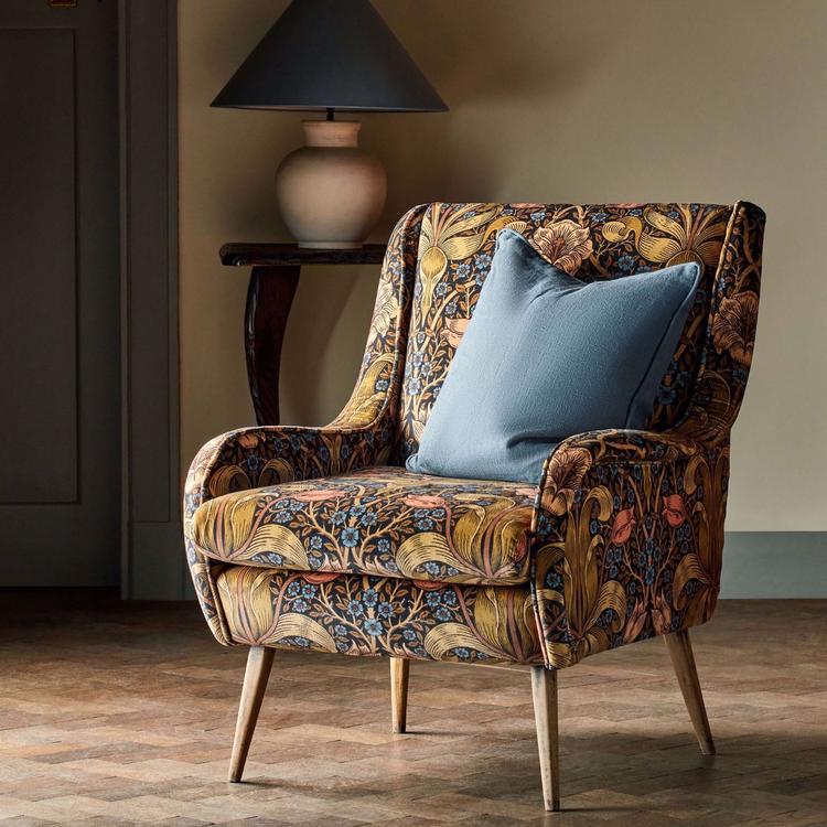 Morris & Co Spring Thicket velvet fabric in “Old Fashioned” colourway – rich rust and jewel‑toned large‑scale tulip and foliage design on cotton‑rich velvet, ideal for drapes, upholstery, headboards or cushions.