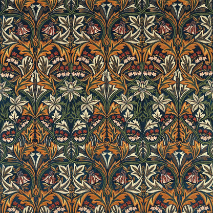 Bluebell Embroidery Velvet Fabric in Indigo & Russet by Morris & Co. features an embroidered floral design inspired by William Morris's 1876 Bluebell pattern. This luxurious velvet fabric in deep indigo blue and warm russet tones is ideal for upholstery, drapery, decorative pillows, window shades, and elegant interior design projects.