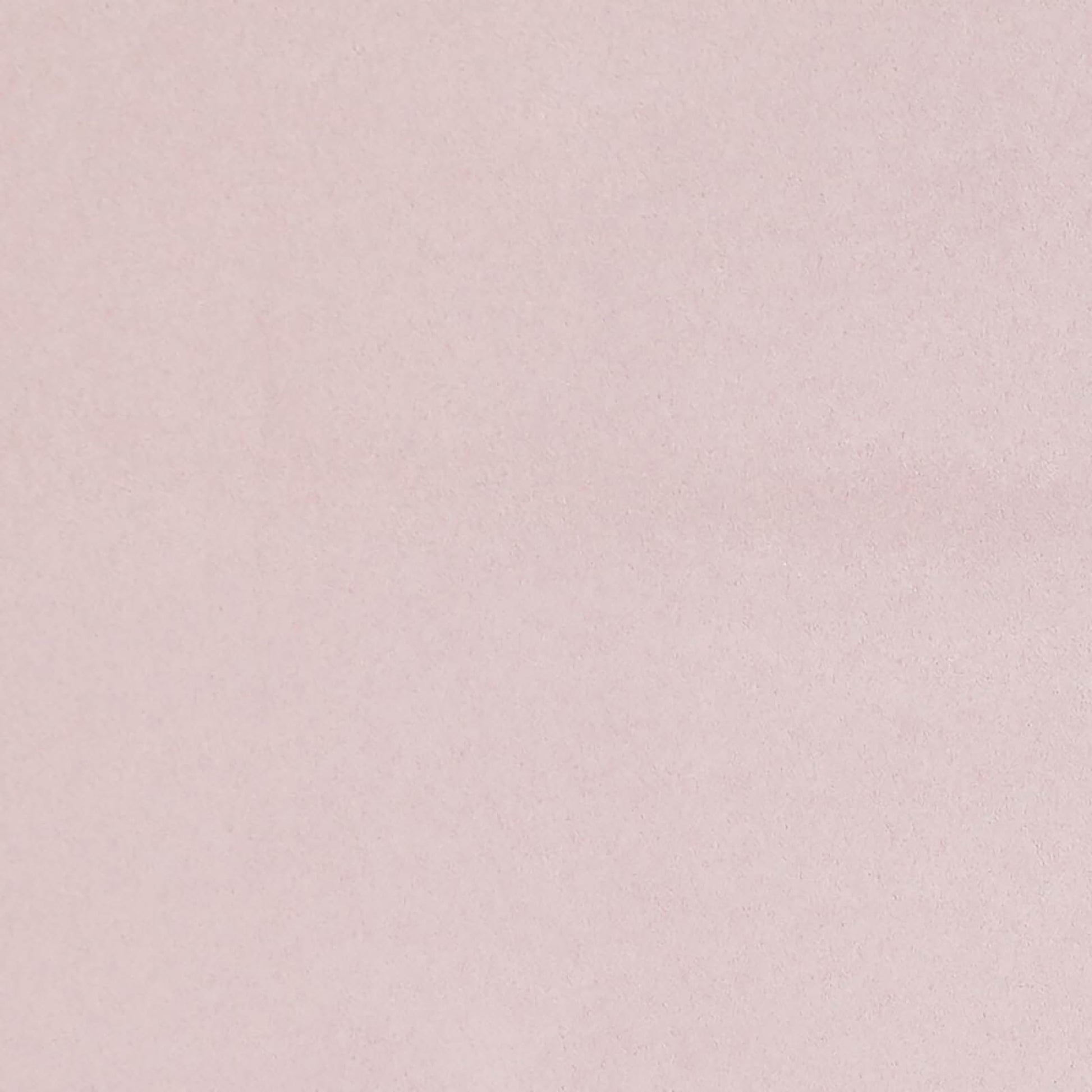 Soft pink faux suede fabric swatch with a velvety matte finish.