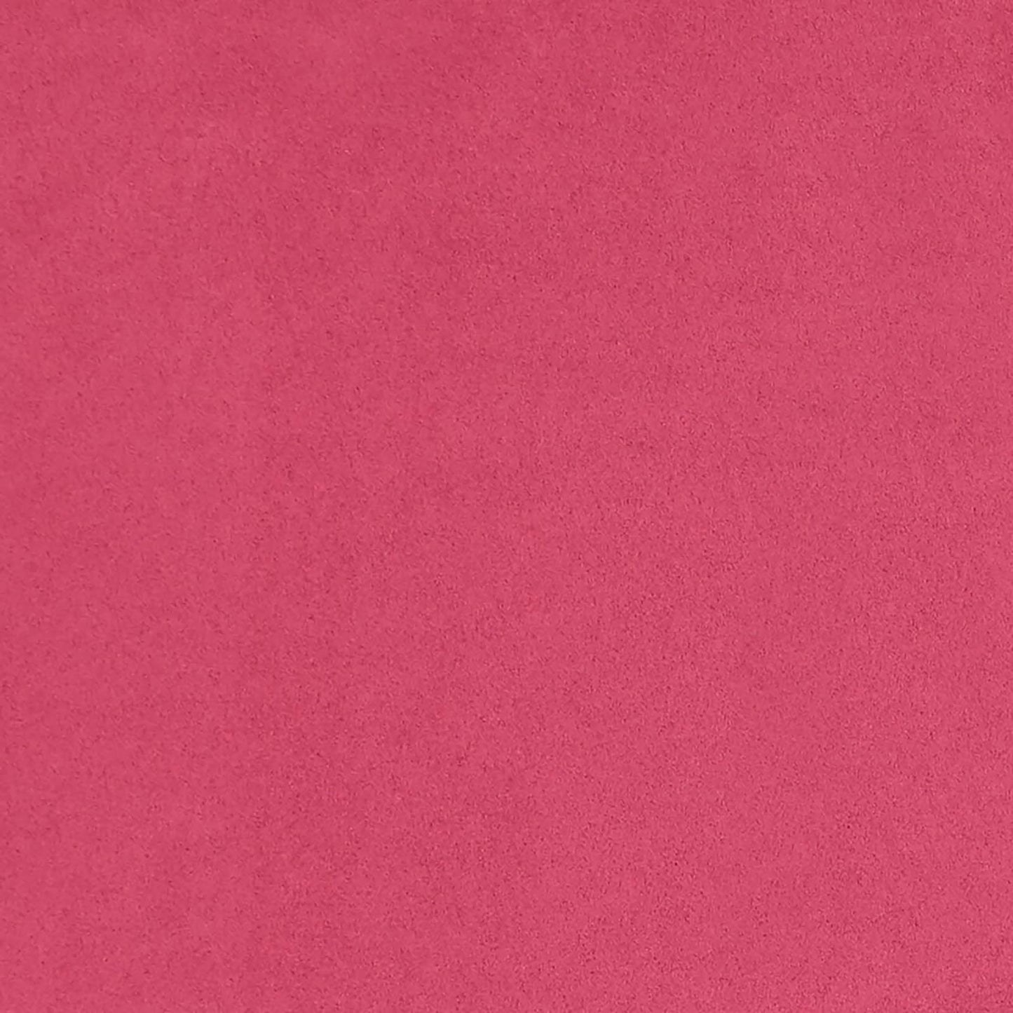 Bright pink faux suede fabric texture with a soft matte finish, close-up.