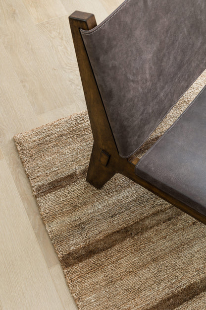 Beige textured striped rug.