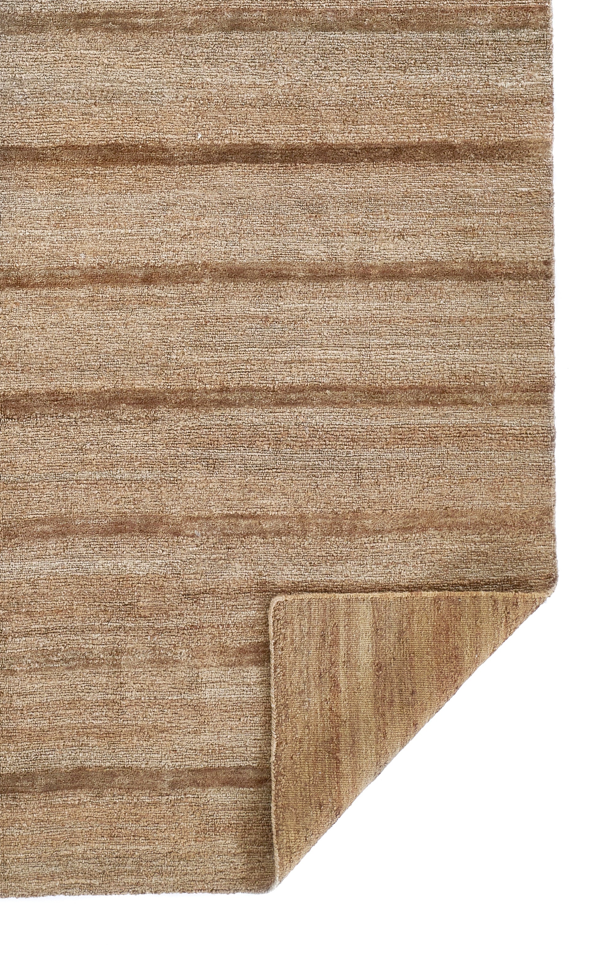 Natural brown striped rug with soft, textured pile; folded corner reveals underside.