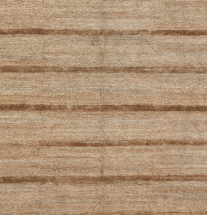 Natural beige jute rug with textured weave and subtle brown horizontal stripes.