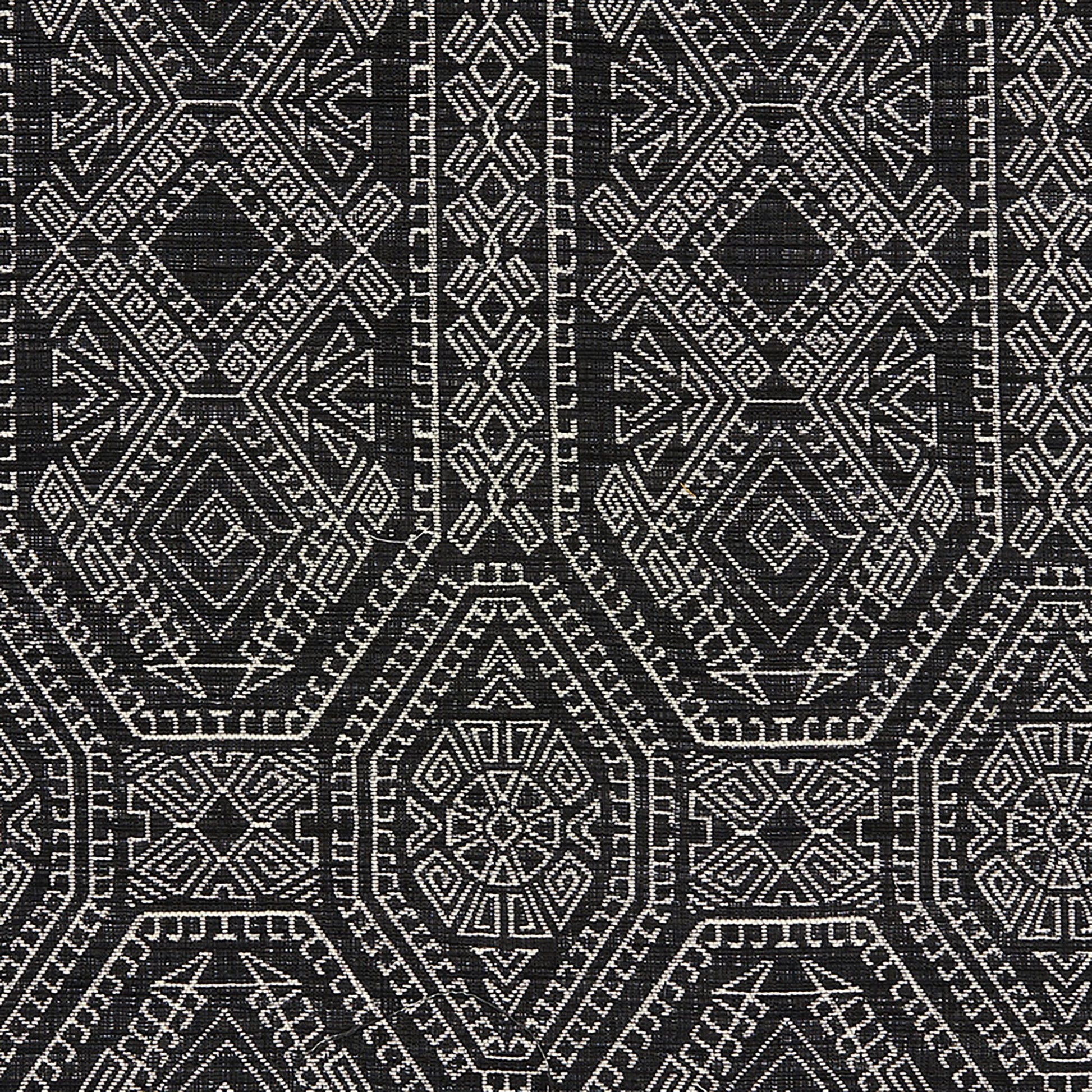 Black and white Navajo-inspired geometric pattern with diamonds and hex motifs on a woven Jacquard fabric.