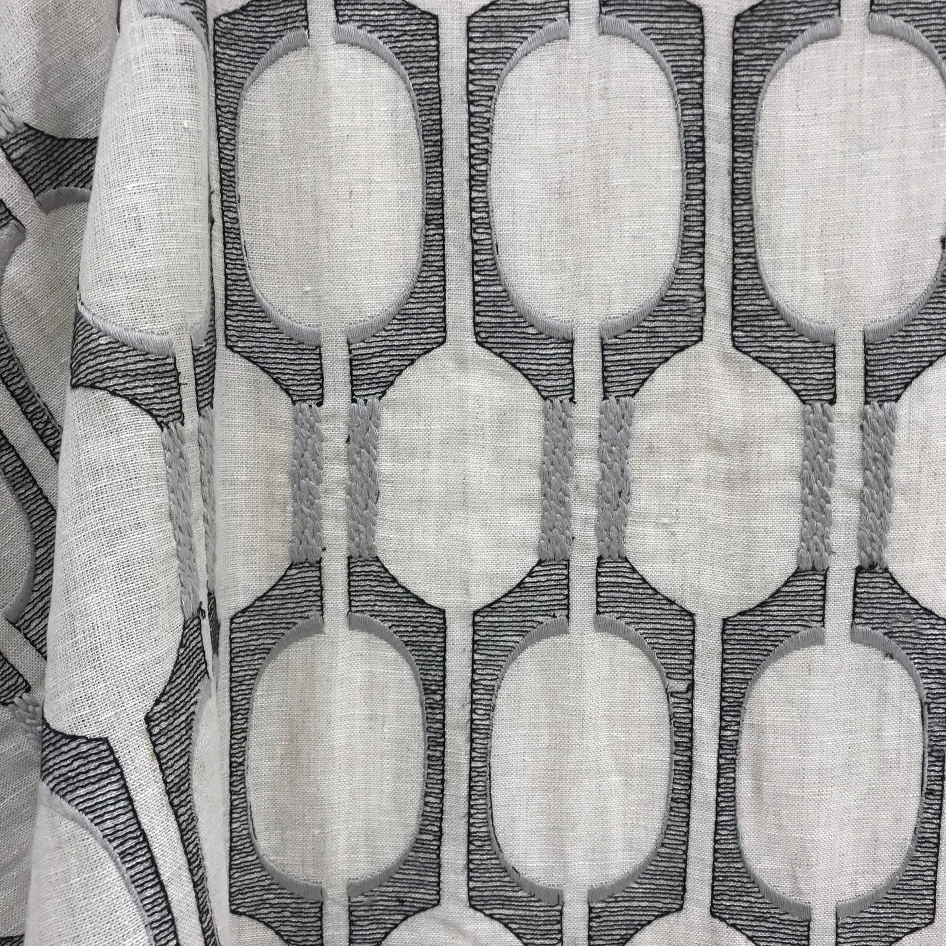 Light gray linen-look fabric with a repeating dark-gray oval chain pattern; for drapes or upholstery.