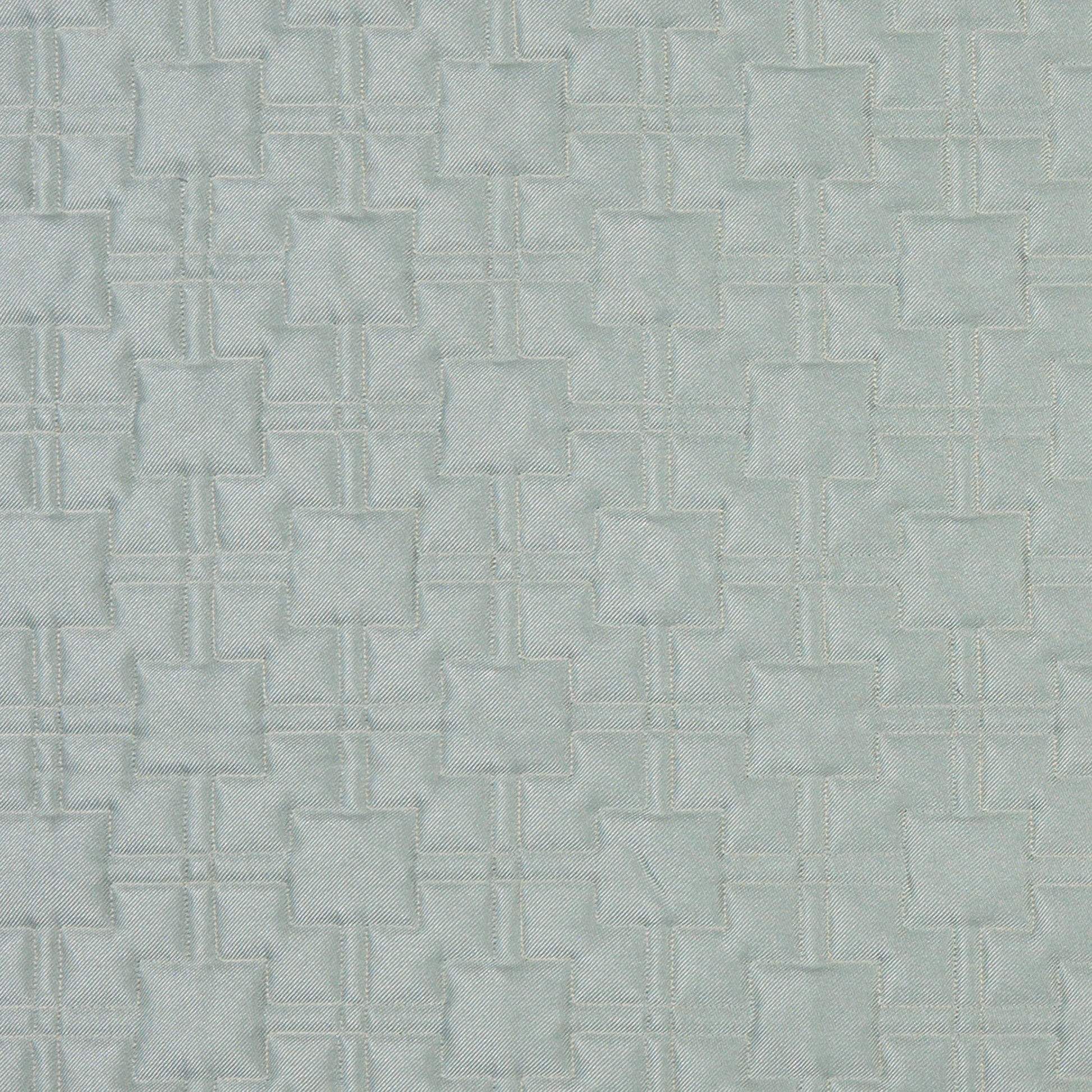 Light blue-gray matelassé fabric with a repeating geometric raised square motif connected by stitched lines.