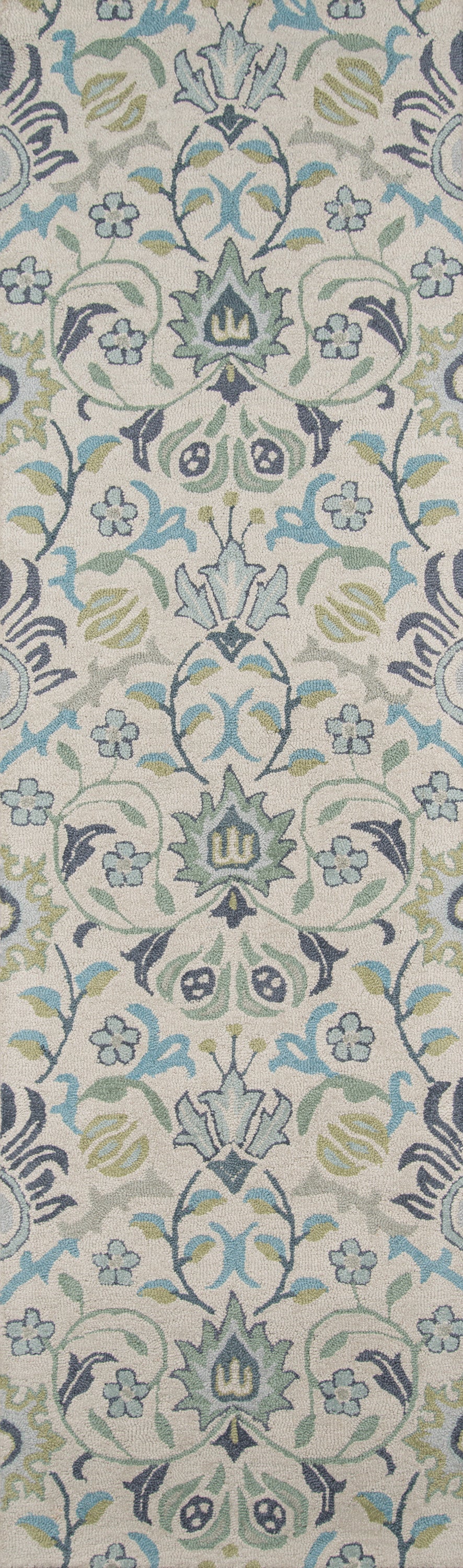 Woven damask floral rug in blue, green, and gray on a beige background.