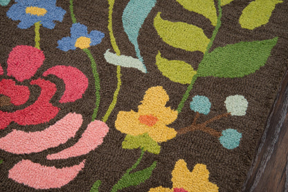 Brown floral tufted rug featuring bright yellow, pink, and blue flowers with green leaves.