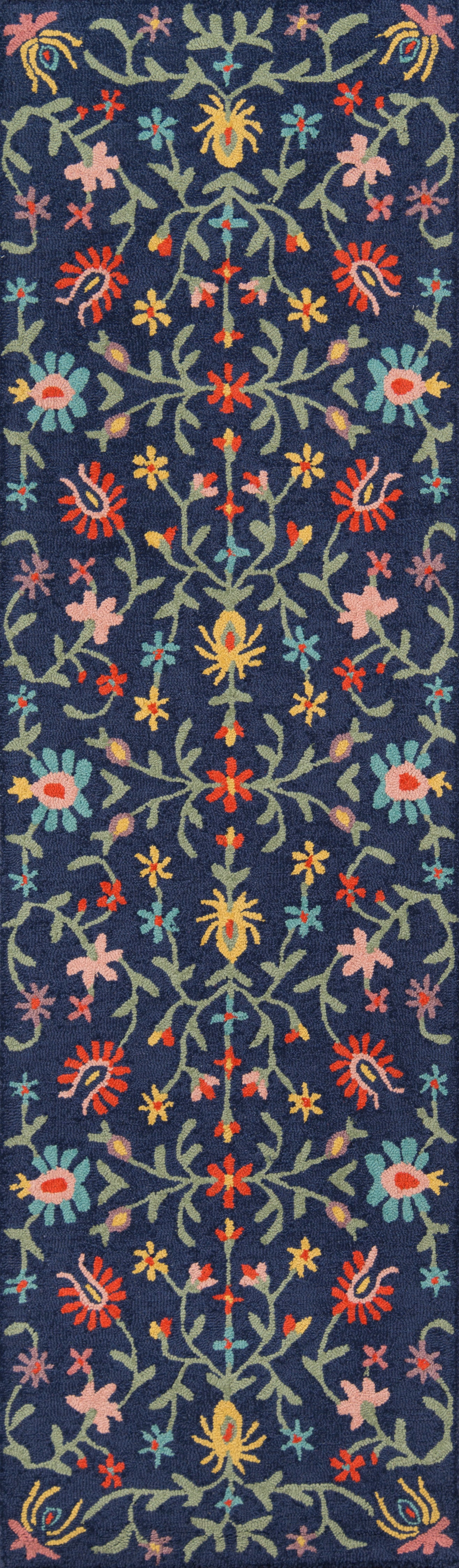Navy blue oriental-style rug with multicolor floral vines and blossoms in yellow, pink, red, teal; symmetrical pattern.