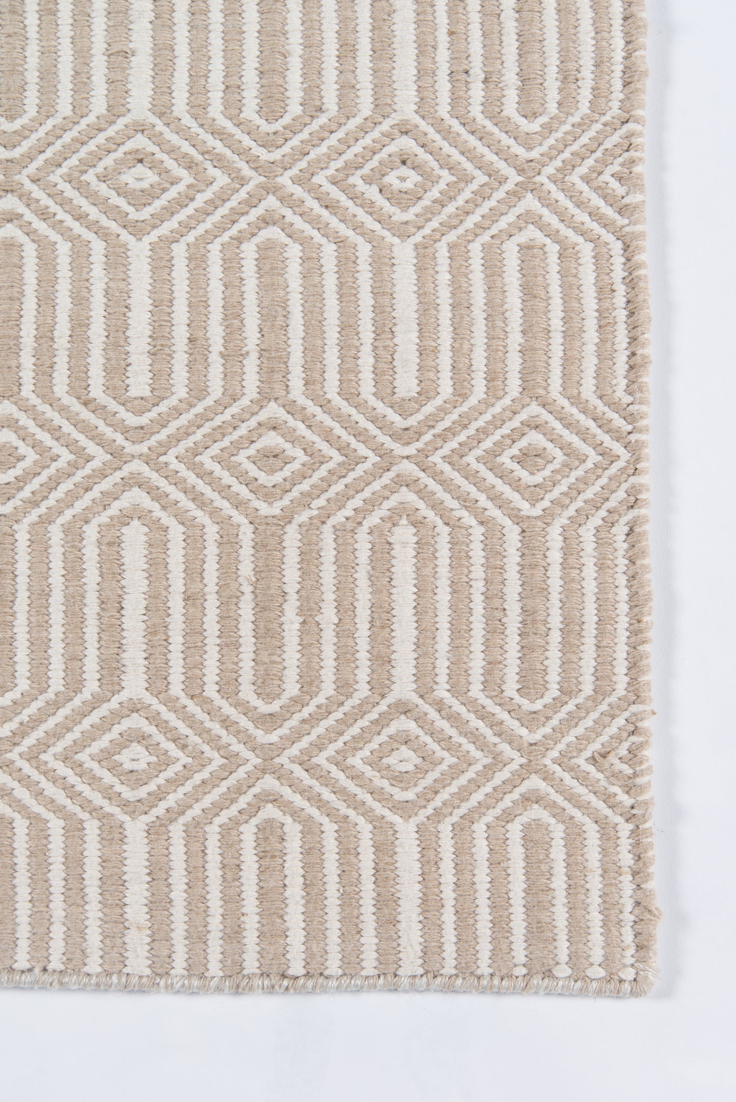 Beige and ivory geometric rug with diamond and vertical stripe patterns; woven texture and fringed edge.