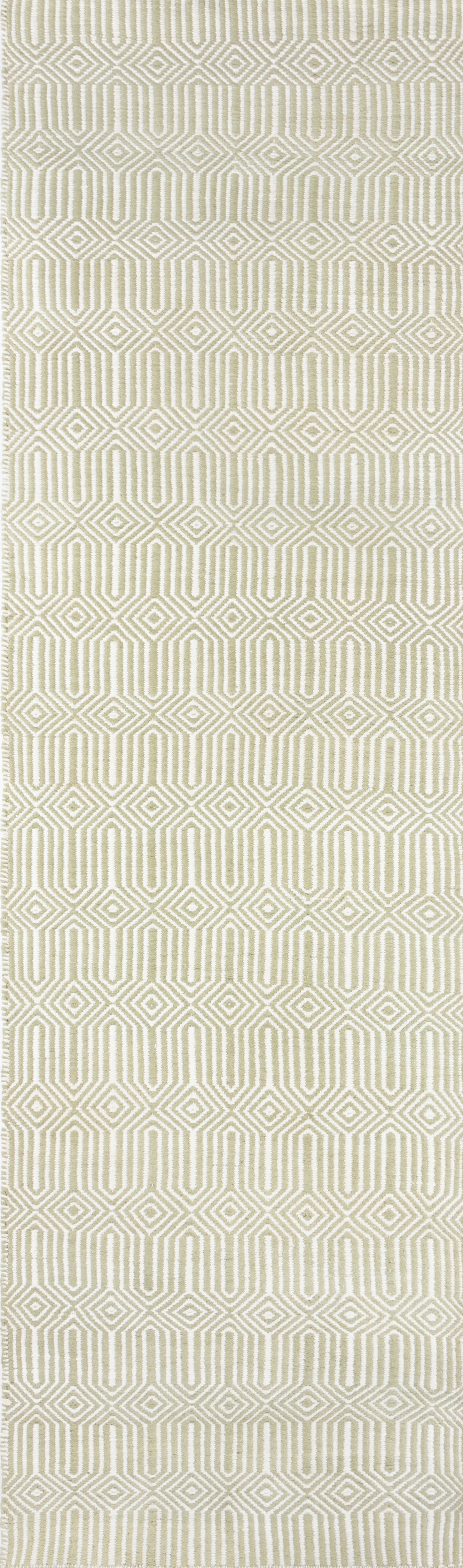Sage green and ivory geometric woven area rug with interlocking diamond patterns, mid-century modern style.