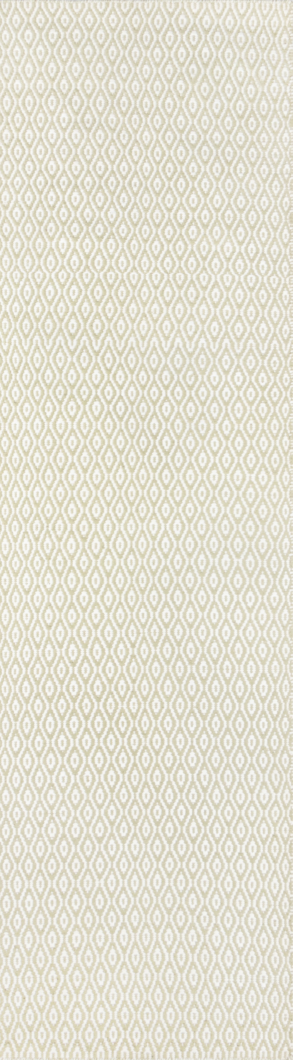 Cream and pale-green diamond lattice woven rug.