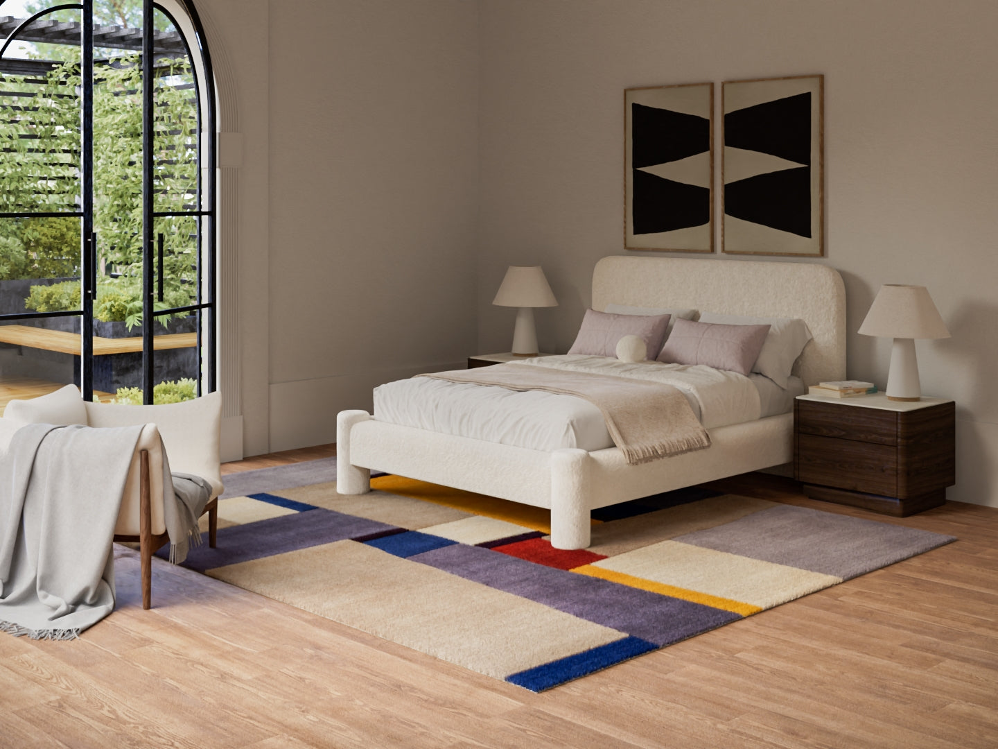 Cream upholstered bed with matching nightstands, beige lamps, abstract art, and a geometric rug in a modern bedroom.