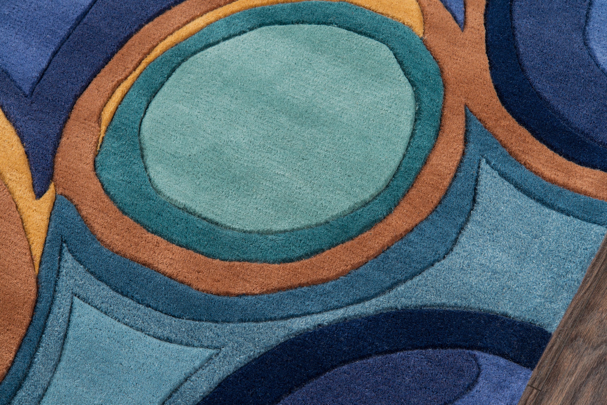 Abstract ring-pattern rug in teal, turquoise, navy blue and orange; plush pile, mid-century modern style.