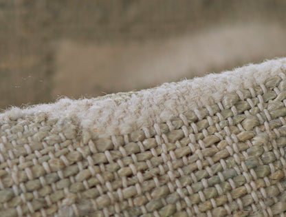 2' x 8' natural beige jute runner rug with chunky woven texture and white fringe along the edge