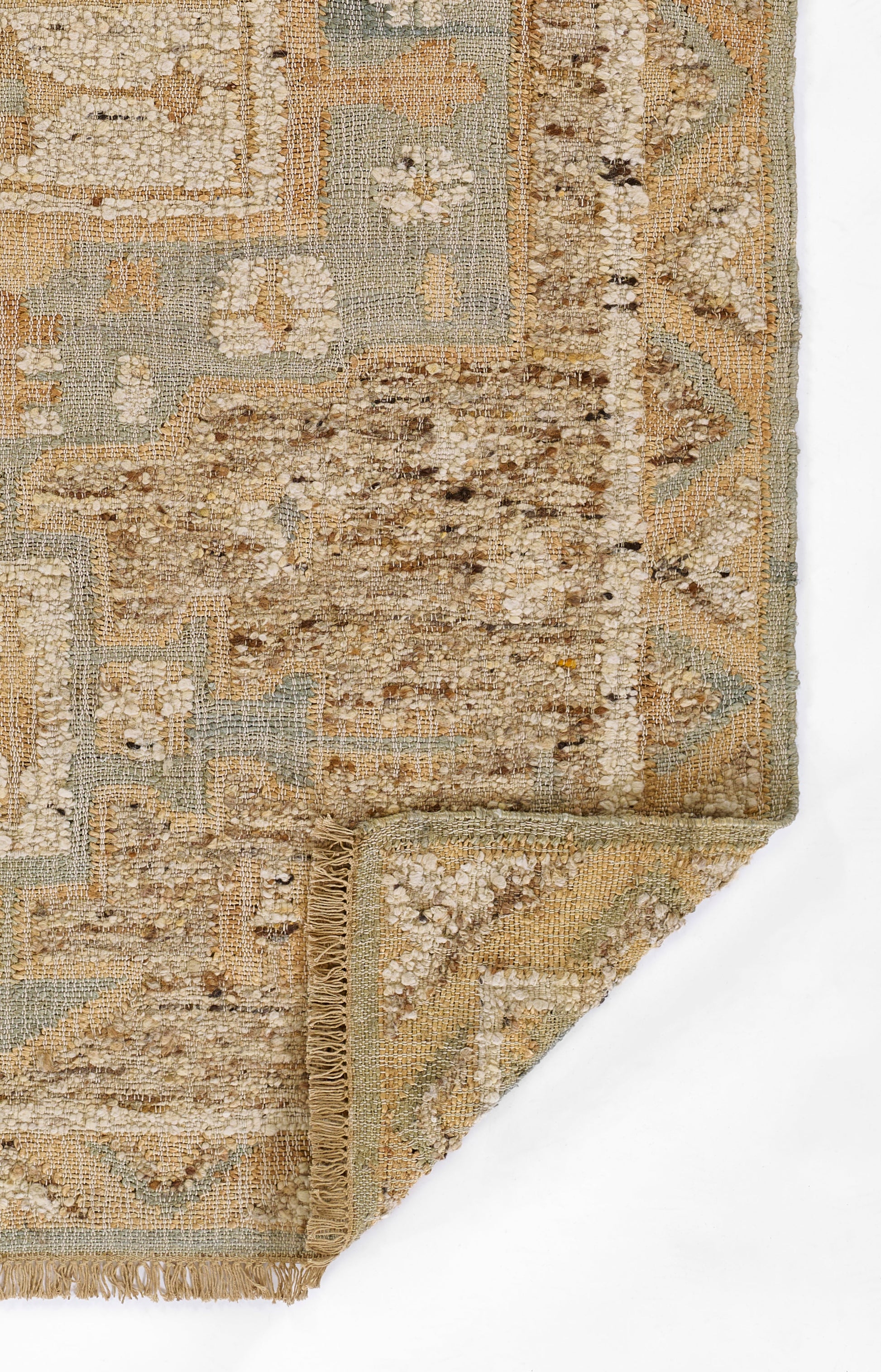 Beige, cream, & pale blue oriental rug with floral motifs, fringed border, folded corner.
