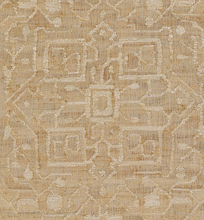 Rectangular beige and ivory woven area rug with a geometric interlocking square and diamond motif.