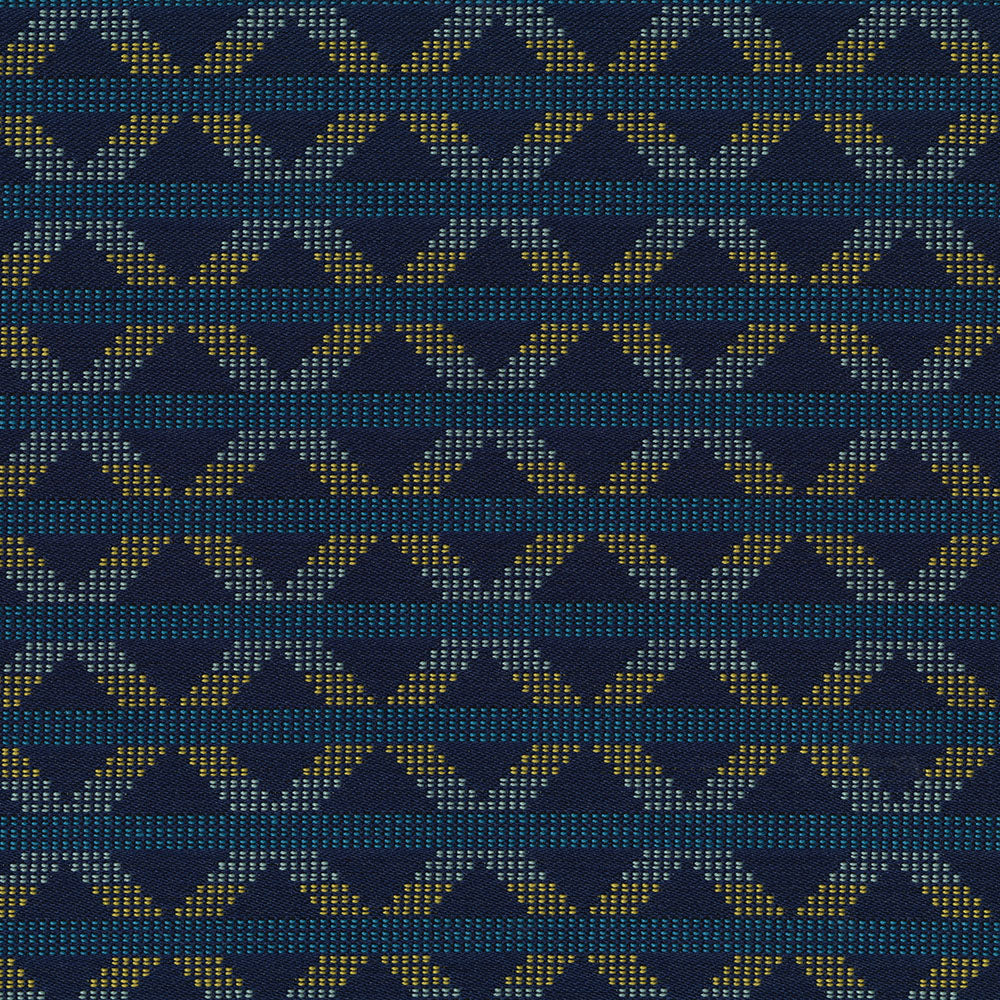 Navy blue woven fabric featuring teal and gold geometric chevrons and diamonds for decorative upholstery textile