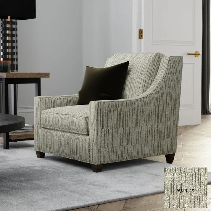 Gray armchair with a black pillow in a room setting NicholasJohn Fabric