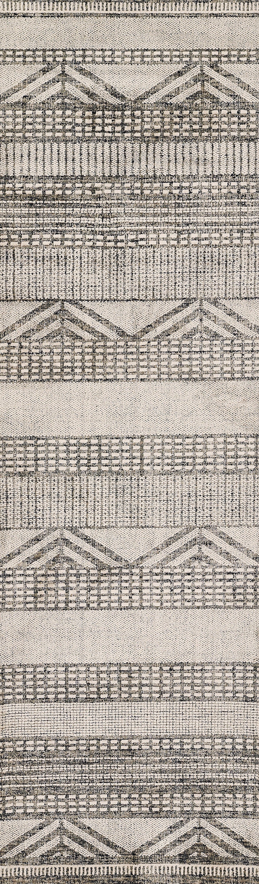 Neutral beige and charcoal woven rug with chevron and lattice geometric stripes, textured pattern.