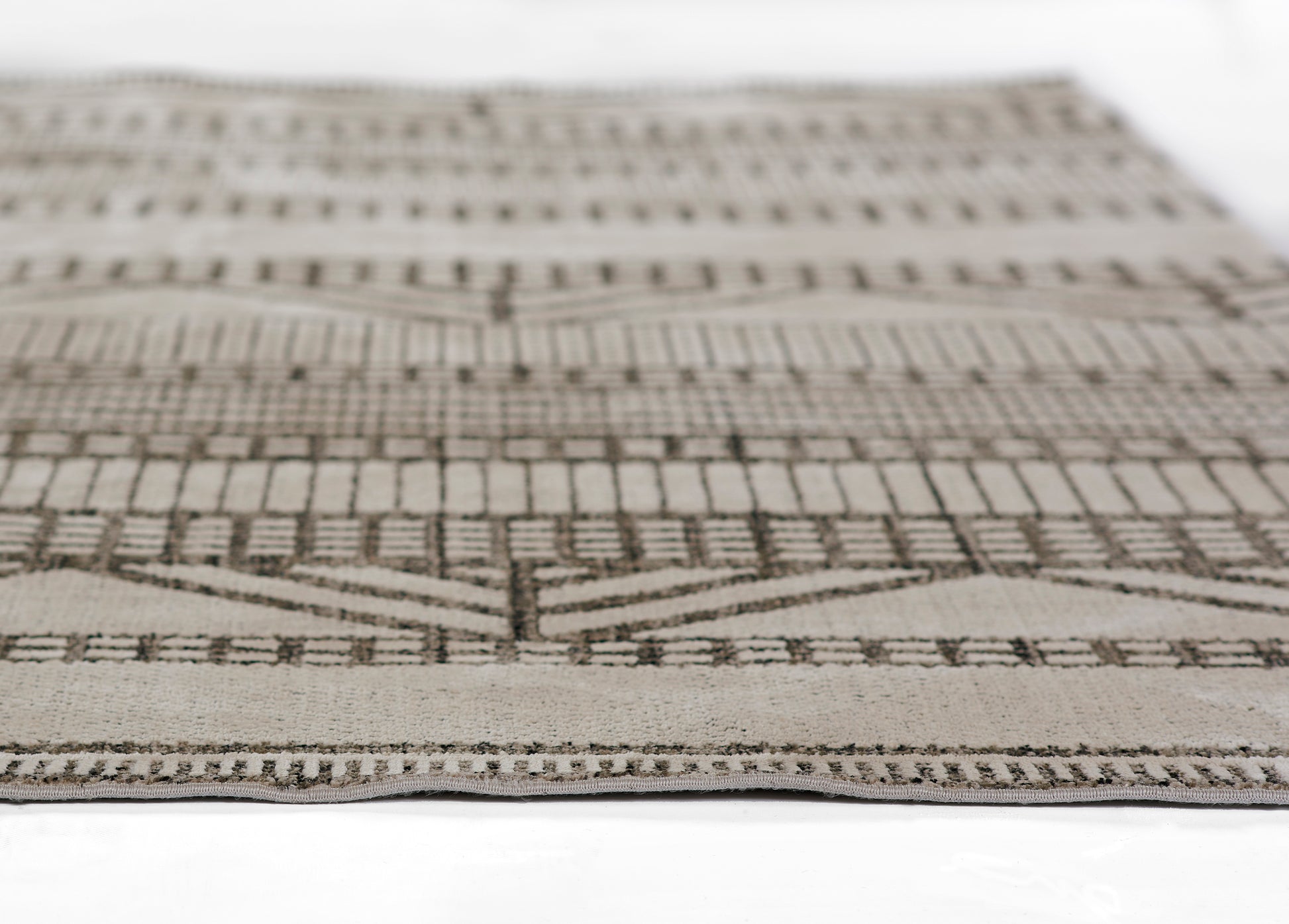 Beige & taupe woven rug, 2' x 3', with geometric chevron & stripe motifs; rectangular area rug for living spaces.