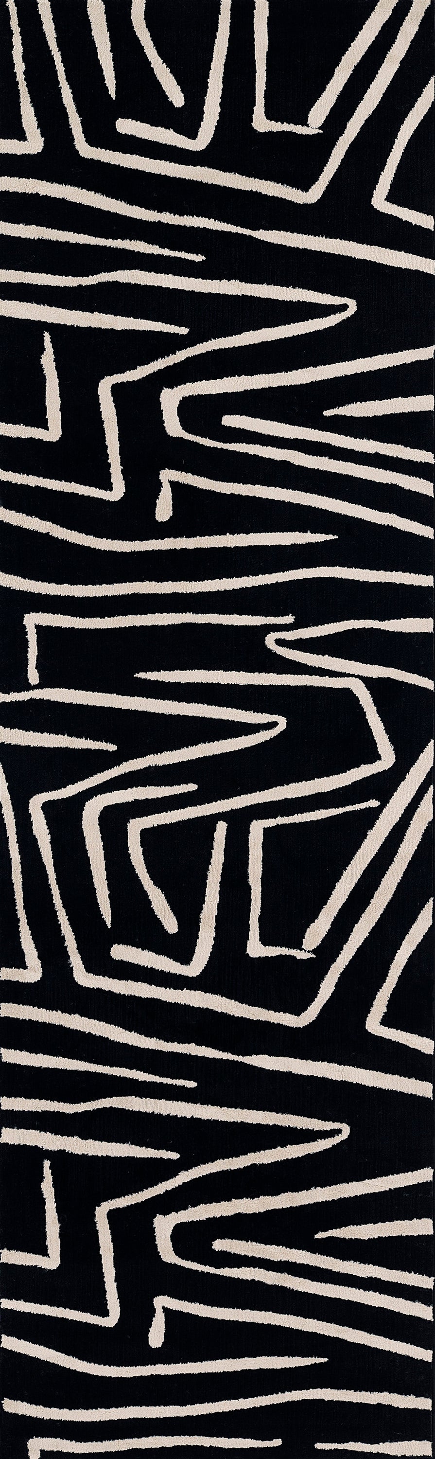 Black rug with cream hand-drawn geometric zigzag lines.