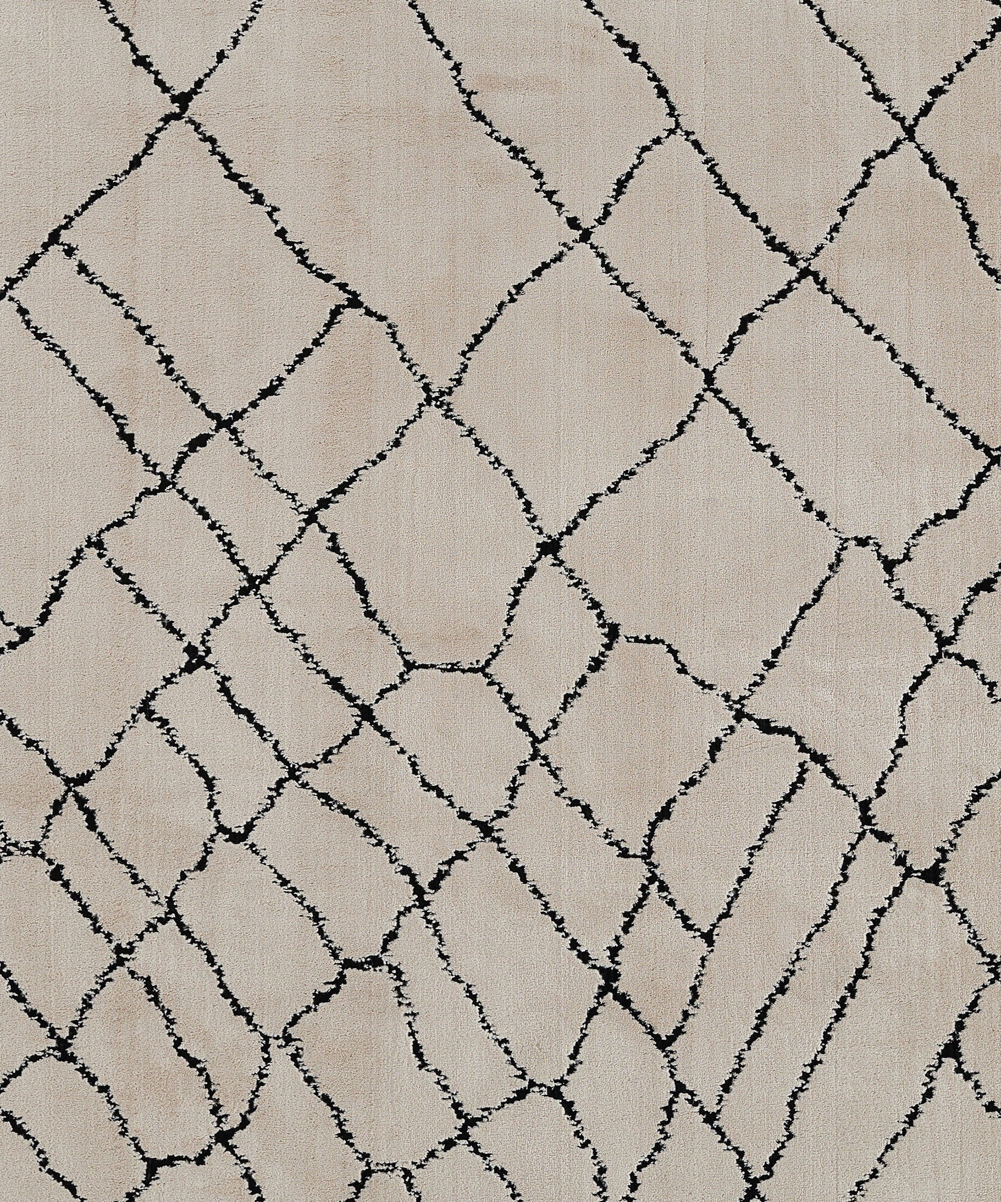 Beige rug with irregular black diamond lattice pattern; modern geometric style.