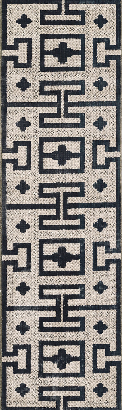 Ivory and navy geometric rug with Greek key motifs and cross accent squares; textured modern-traditional style.