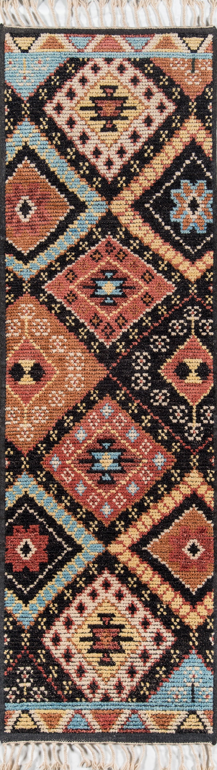 Vibrant tribal runner with diamond motifs in red, blue, cream and black; fringed ends; 2' x 8'.
