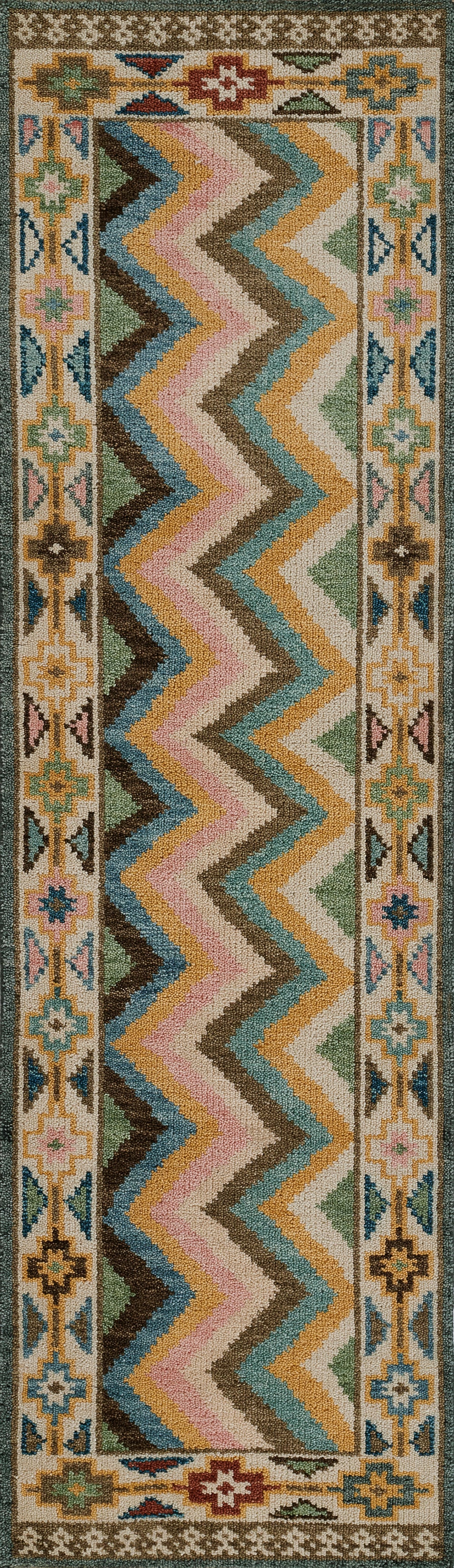 8' x 11' area rug with pastel chevron center in pink, teal, blue, yellow and brown; cream background with floral border.