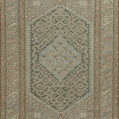 Nomad style woven rug in blues & beiges with a central diamond medallion & geometric lattice border.