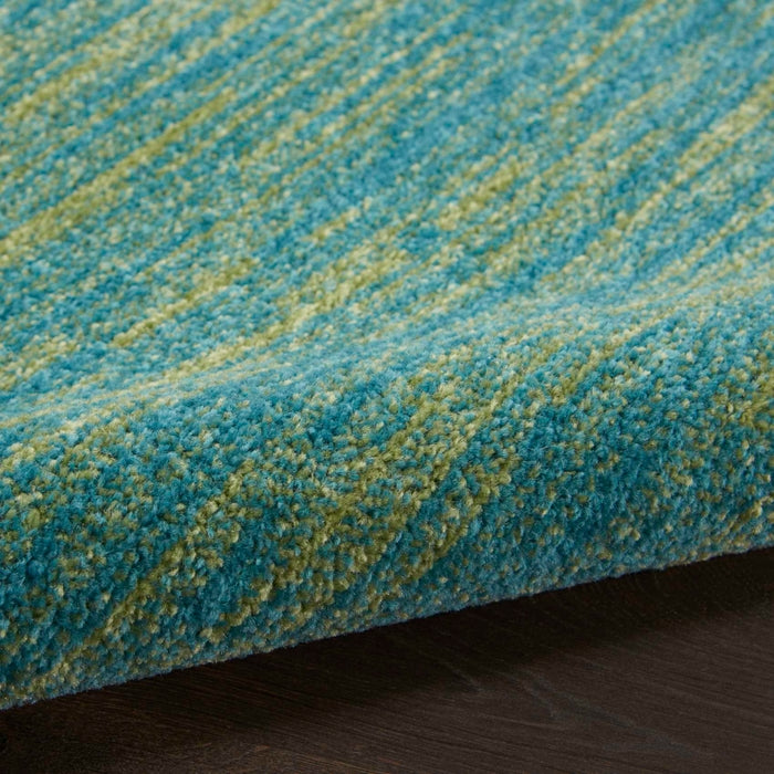6 foot round Blue Green Nourison Essentials area rug, durable indoor outdoor round rug with modern solid texture, versatile blue and green rug for living room, patio, bedroom, dining area, coastal décor, and high traffic home spaces.