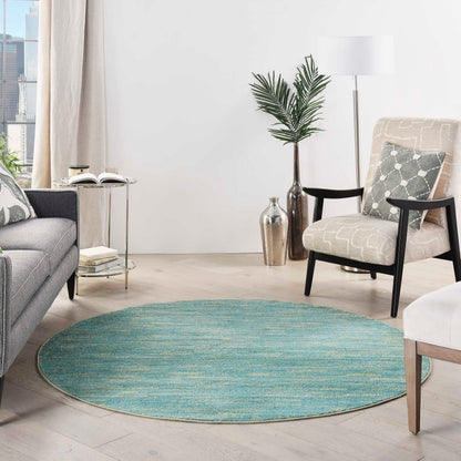 6 foot round Blue Green Nourison Essentials area rug, durable indoor outdoor round rug with modern solid texture, versatile blue and green rug for living room, patio, bedroom, dining area, coastal décor, and high traffic home spaces.