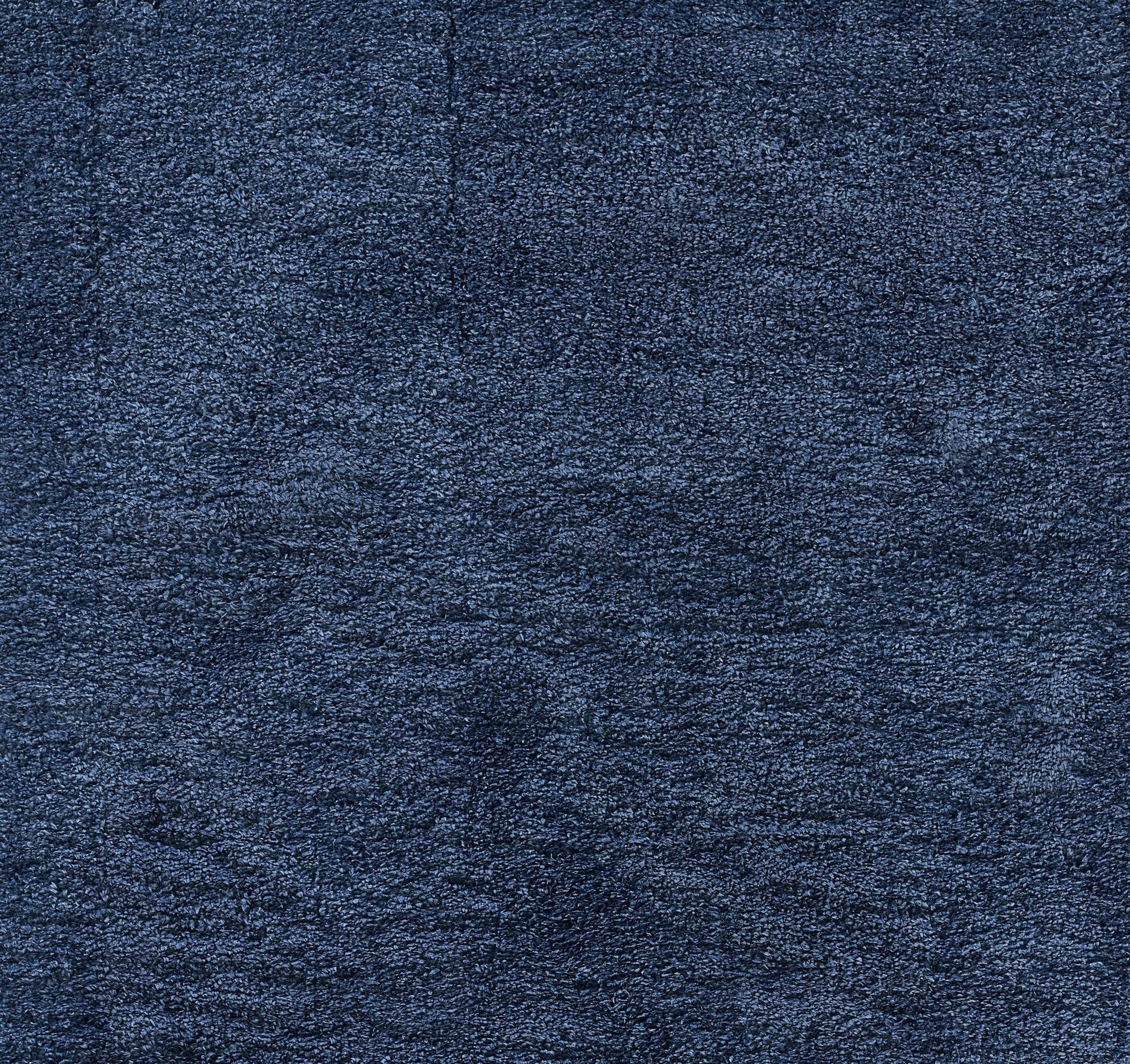 Dark navy blue plush fabric with dense, textured pile; versatile for rug or upholstery.