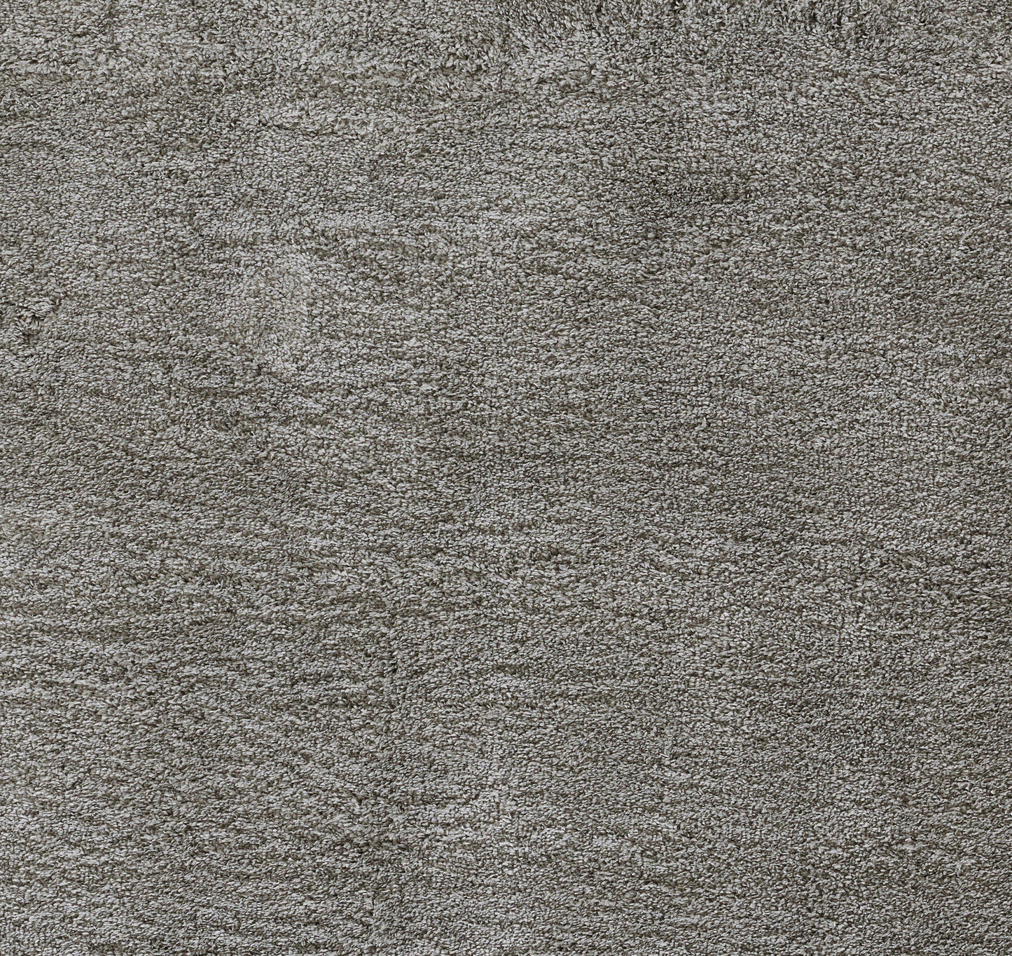 Close-up of gray heather shag rug with soft plush pile.