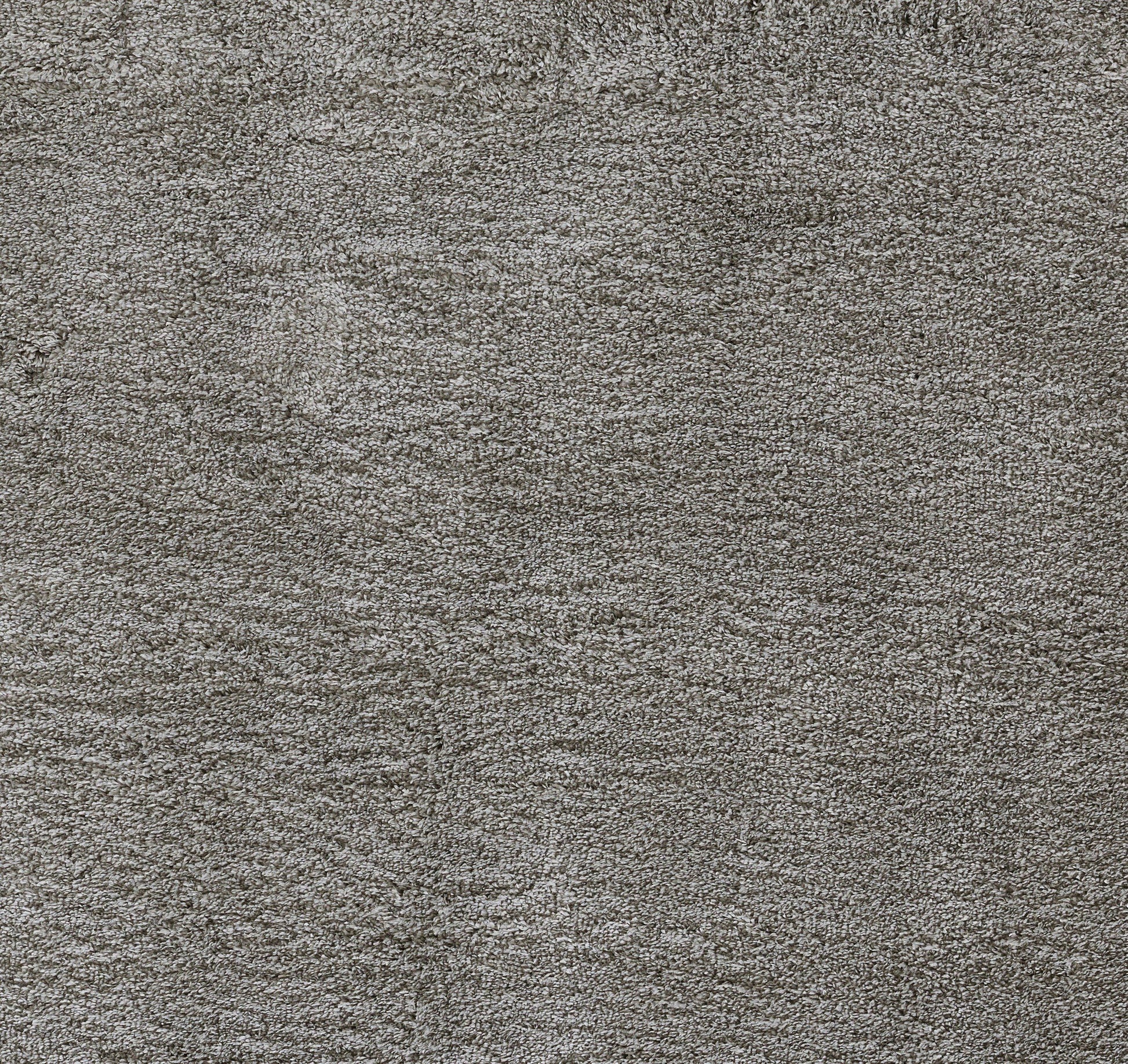 Close-up of gray heather shag rug with soft plush pile.