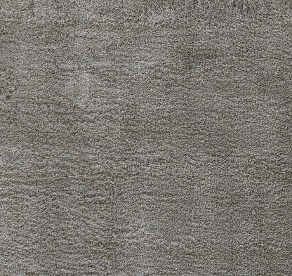 Close-up of gray heather shag rug with soft plush pile.