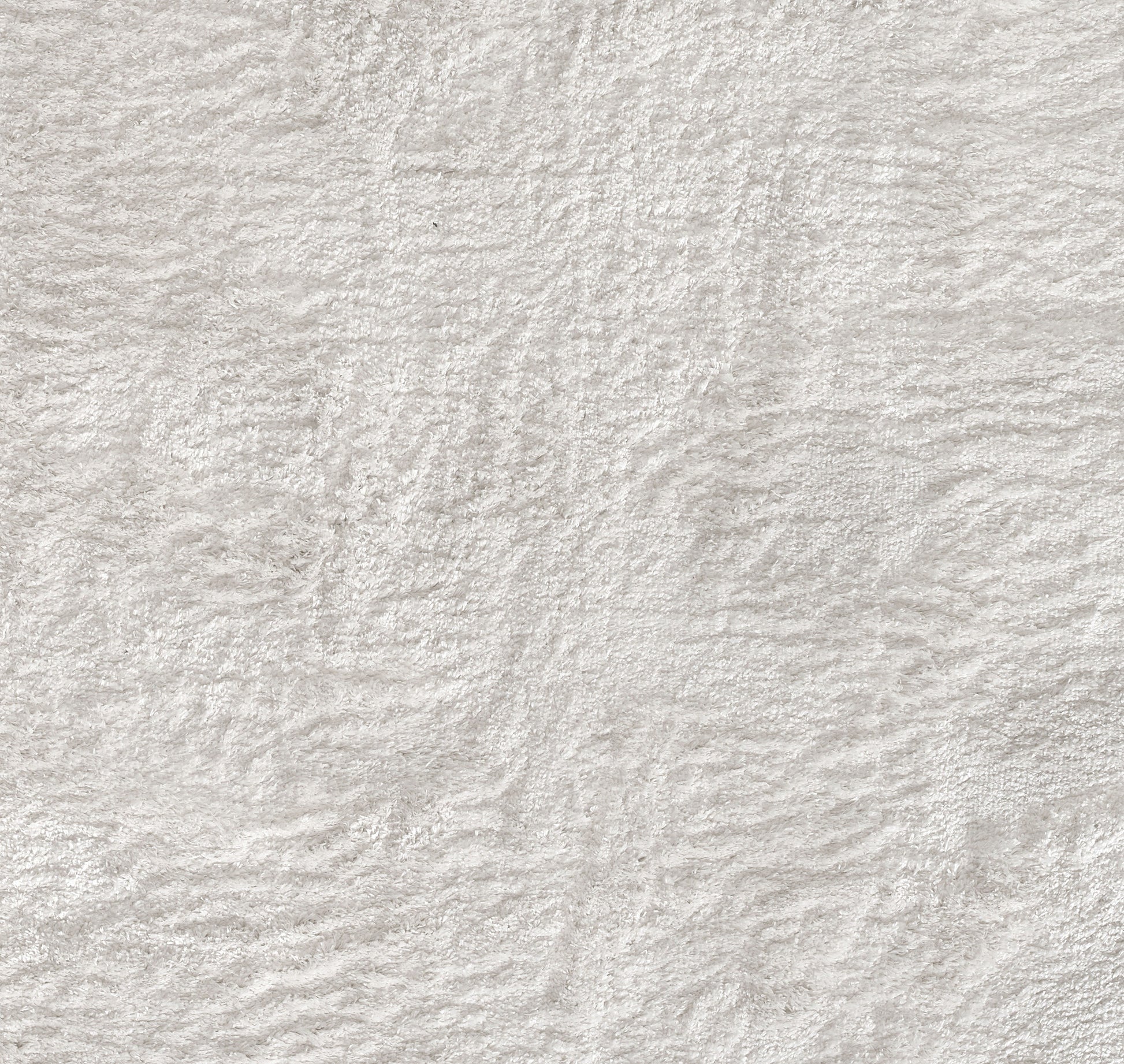 Soft beige-gray textured fabric surface with plush, irregular pile for cozy interior decor.
