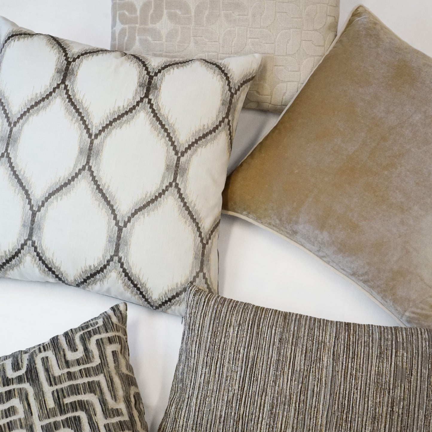 Neutral-tone decorative pillow with a geometric trellis pattern, velvet and linen textures in beige, ivory and taupe, 24" x 24".