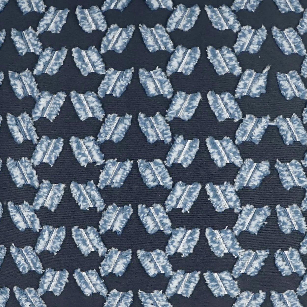 Navy fabric with repeating pale blue diagonal-bar motifs in a geometric grid; woven textile pattern.