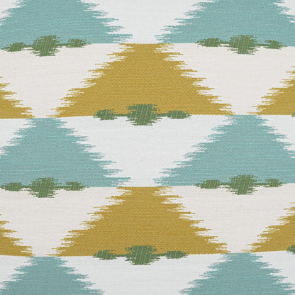 Outdoor lumbar pillow, 12" x 24", with teal and mustard triangular ikat pattern on woven fabric.