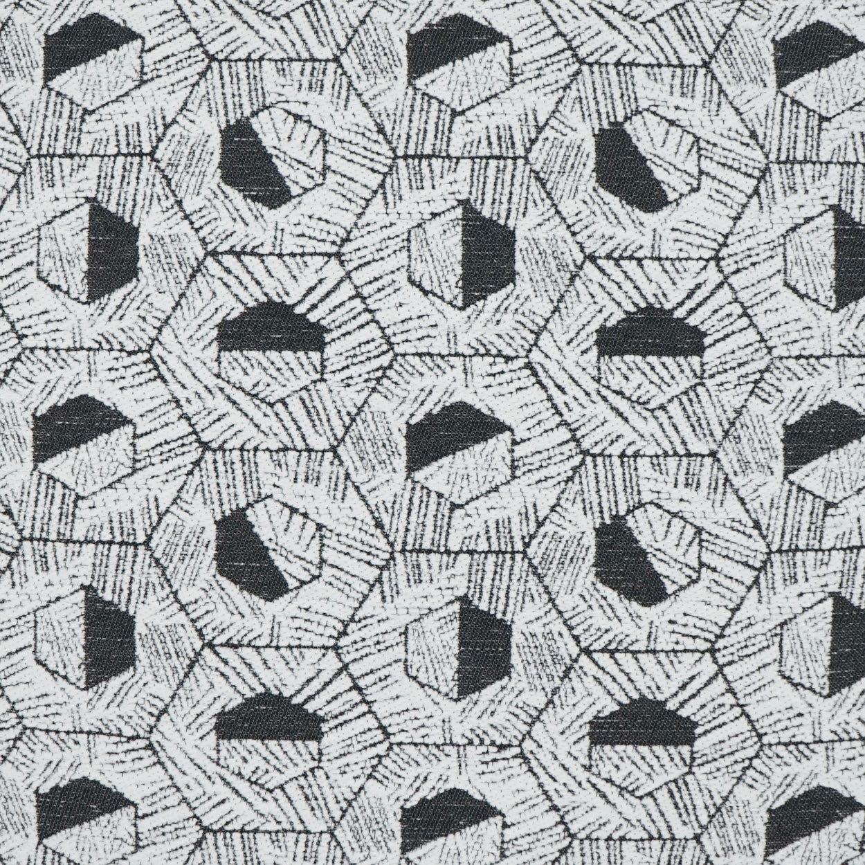Gray woven fabric pillow with a repeating black and white hexagon geometric pattern.