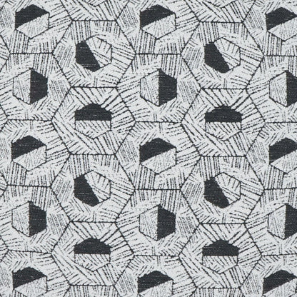 Gray woven fabric pillow with a repeating black and white hexagon geometric pattern.