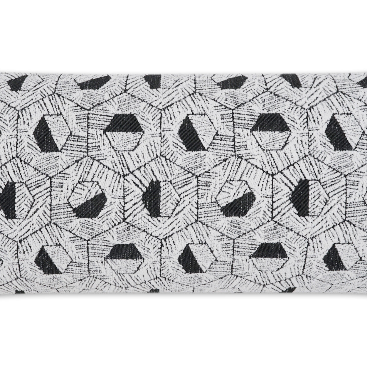 Outdoor lumbar pillow with light grey woven fabric and black geometric circular motifs in a repeating hexagonal pattern (12" x 24").