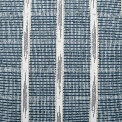 Blue woven fabric with white vertical stripes and gray diamond accents, close-up of an outdoor lumbar pillow plaid check