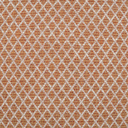 22" x 22" outdoor pillow with orange-brown and cream woven fabric featuring a diamond lattice pattern.