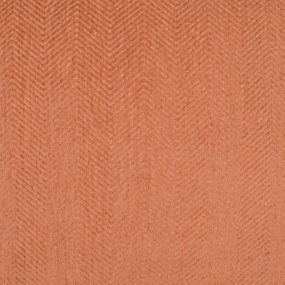 Outdoor 12 x 24 inch lumbar pillow with adobe chevron pattern in warm peach-orange tones.