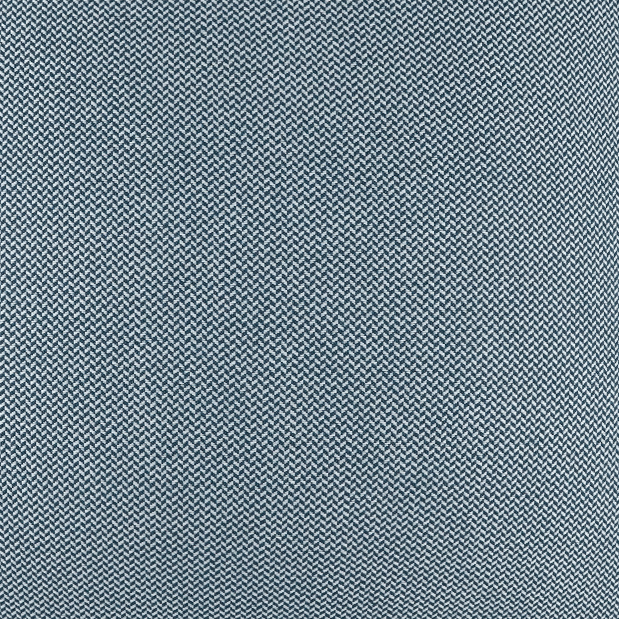Blue denim-style herringbone fabric with subtle white flecks; durable woven textile for jackets or upholstery.