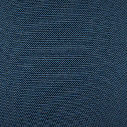 Close-up of navy blue twill fabric with tight diagonal weave; durable textile texture.